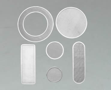 Several filter discs manufactured with different shapes.