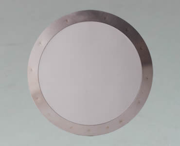 The filter disc made of woven wire mesh with aluminum framed edge.