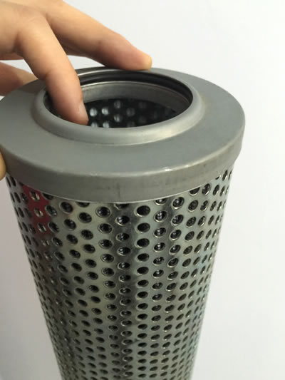 A hand is pressing the edge of perforated tube.