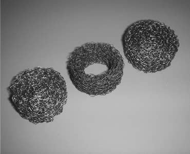 Three round knitted wire mesh filters made of black wire mesh