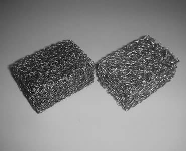 Two square knitted wire mesh filters made of wire mesh plated black zinc.